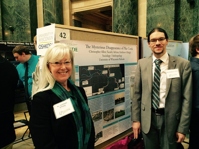 Professor Kate Gillogly and student Christopher Allen at Posterd in the Rotunda