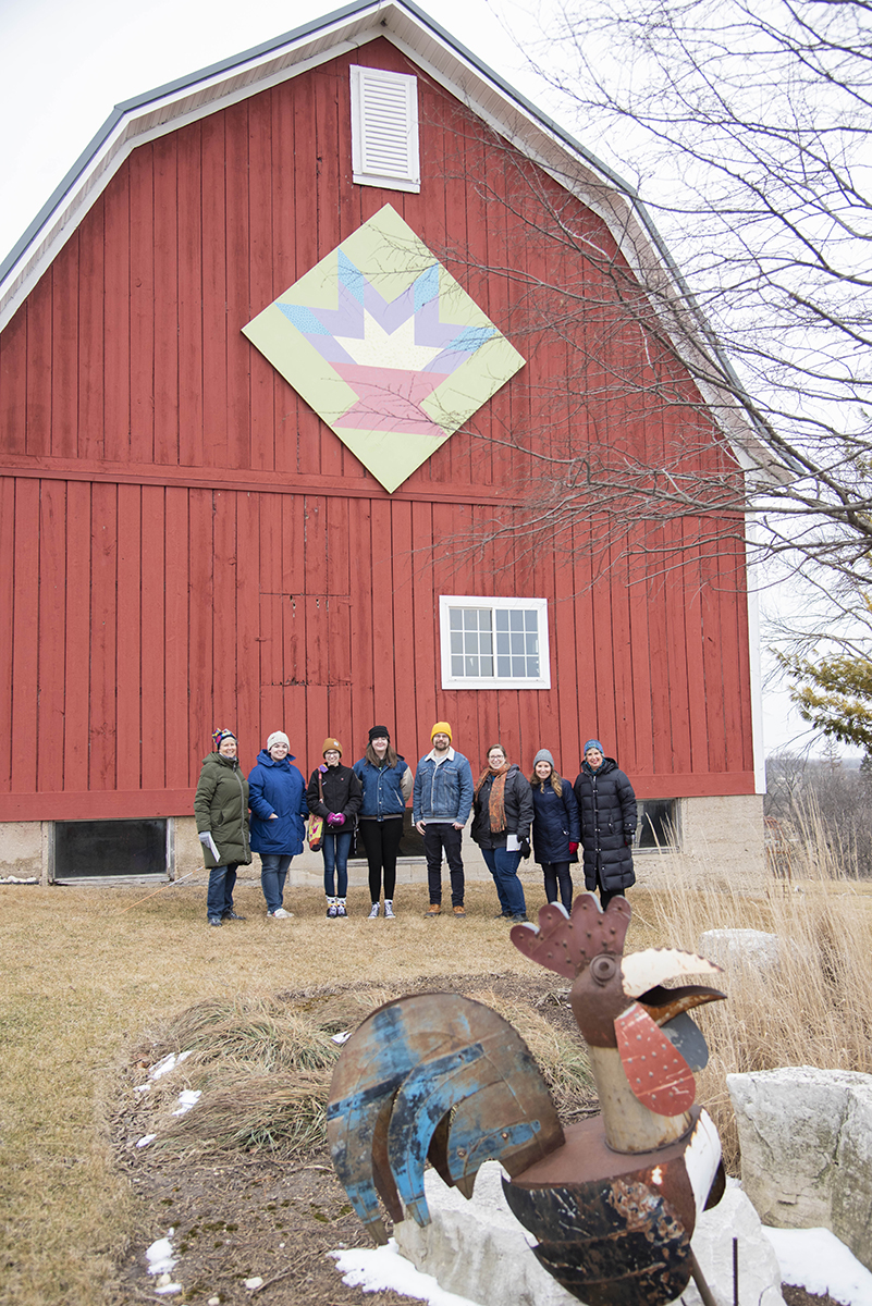 UW-Parkside students pose outside The Tulip Basket, one of many Quilts on Barns in Racine County.