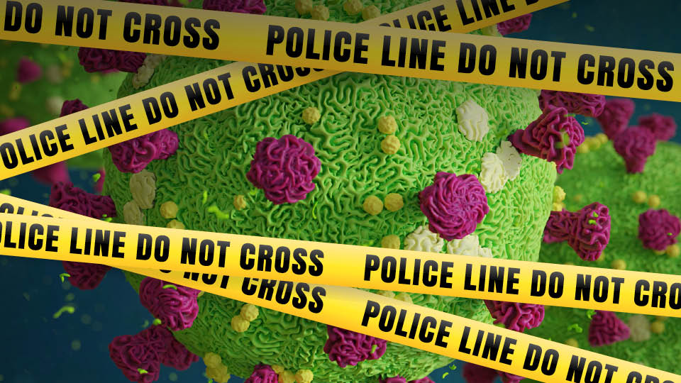 image of the corona virus with police tape in front of